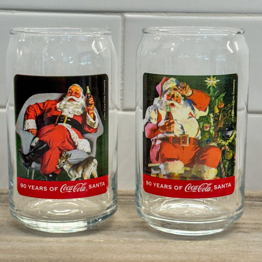 Coca-Cola 90 Years of Santa Can Glasses Set of 2 Haddon Sundblom Silver Buffalo